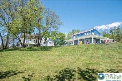 Tucked away on nearly 42 SCENIC ACRES this CHARMING FARMHOUSE - photo 1