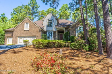 Located in the Pinehurst No. 6 neighborhood, this custom-built - photo 1