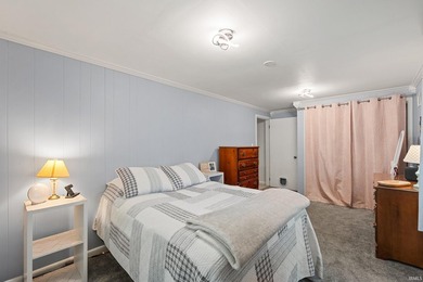 Tucked into a peaceful setting with mature trees and open green - photo 20