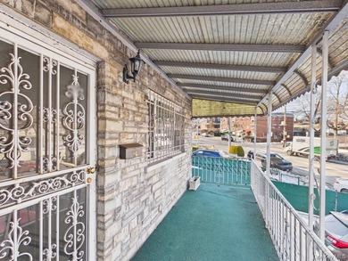Semi-detached two-family home located in the Allerton section of - photo 2
