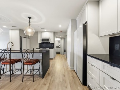 Turnkey luxury and breathtaking lakefront views await in this - photo 12