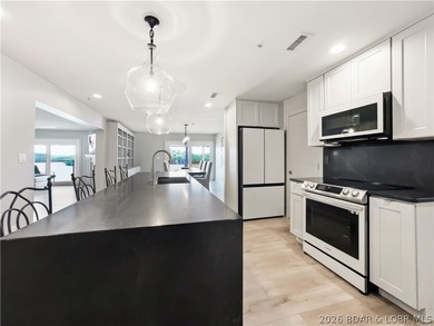 Turnkey luxury and breathtaking lakefront views await in this - photo 13