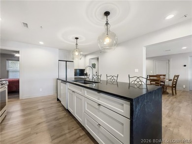 Turnkey luxury and breathtaking lakefront views await in this - photo 14