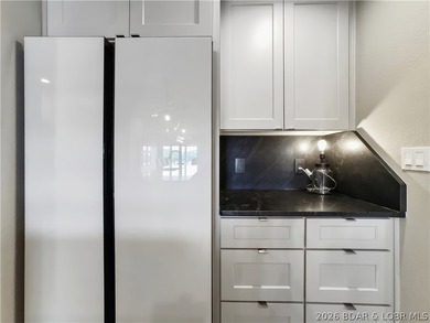 Turnkey luxury and breathtaking lakefront views await in this - photo 15