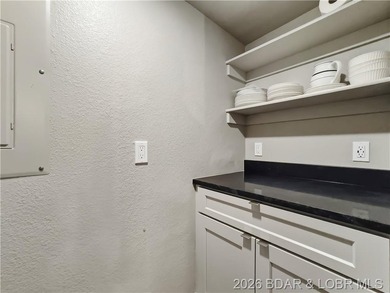 Turnkey luxury and breathtaking lakefront views await in this - photo 16
