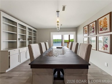 Turnkey luxury and breathtaking lakefront views await in this - photo 18