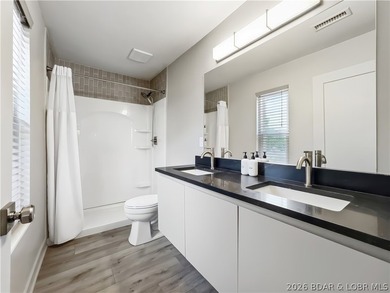 Turnkey luxury and breathtaking lakefront views await in this - photo 21