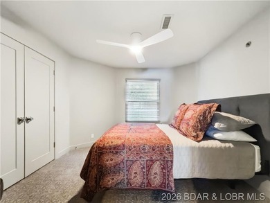 Turnkey luxury and breathtaking lakefront views await in this - photo 24