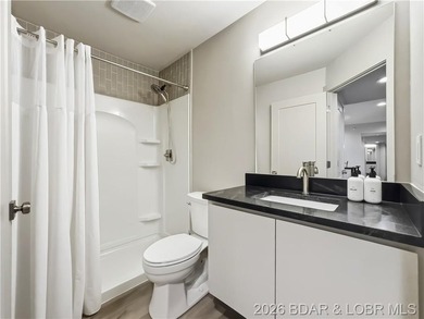Turnkey luxury and breathtaking lakefront views await in this - photo 26