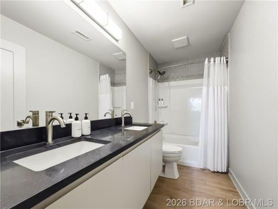 Turnkey luxury and breathtaking lakefront views await in this - photo 32