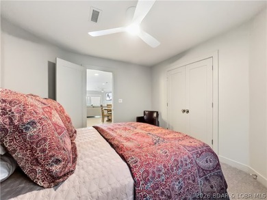 Turnkey luxury and breathtaking lakefront views await in this - photo 36