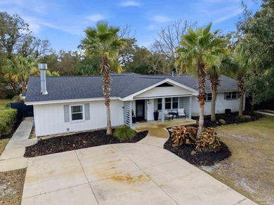 Beautifully landscaped ranch-style pool home located in the - photo 1
