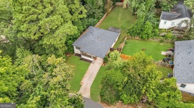 Don't miss this private retreat in the city! 3BR/2BA Mid-Century