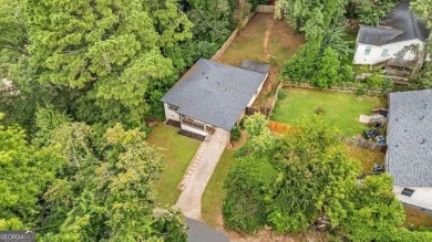 Don't miss this private retreat in the city! 3BR/2BA Mid-Century