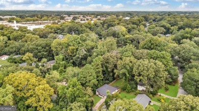 Don't miss this private retreat in the city! 3BR/2BA Mid-Century