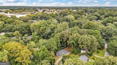 Don't miss this private retreat in the city! 3BR/2BA Mid-Century