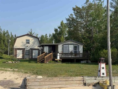 Lake Home For Sale in Carp Lake, Michigan