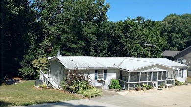 Great lakefront retreat situated on three lots totalling .83 - Lake Home For Sale in Anderson, South Carolina