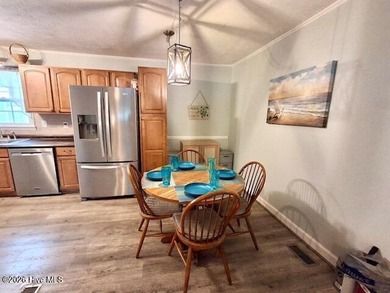 Beautiful 3-bedroom, 2-bath home offering 1,469+/- sq ft of - photo 3