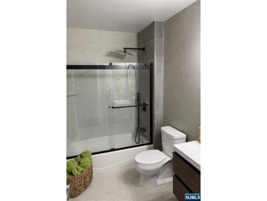 Welcome to this spacious two-bedroom residence at The Greenhouse