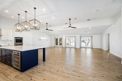 Don't miss out on this beautifully renovated home on open water - photo 4