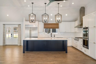 Don't miss out on this beautifully renovated home on open water - photo 10