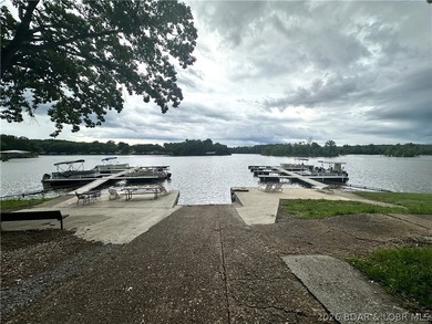 Located at the 86.5MM of the Lake of the Ozarks, this recently - photo 20