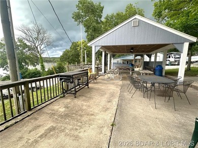Located at the 86.5MM of the Lake of the Ozarks, this recently - photo 24