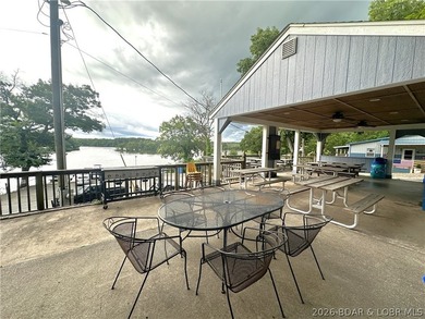 Located at the 86.5MM of the Lake of the Ozarks, this recently - photo 25