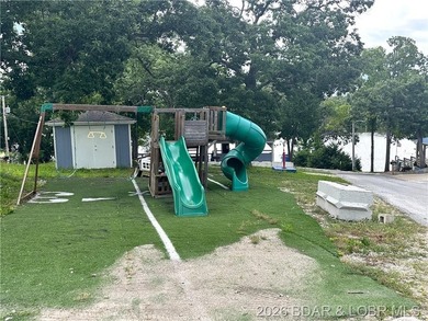 Located at the 86.5MM of the Lake of the Ozarks, this recently - photo 26