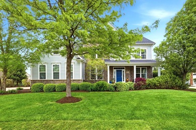 Set on a professionally landscaped lot of more than one-third - photo 1