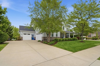Set on a professionally landscaped lot of more than one-third - photo 2