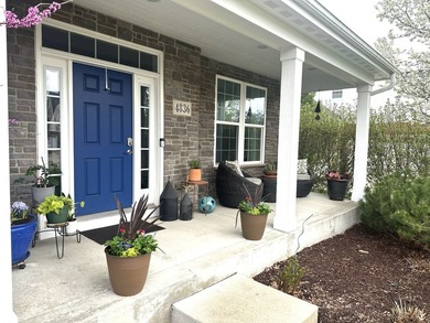 Set on a professionally landscaped lot of more than one-third - photo 4