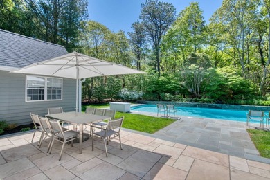 Set on 1.4 exquisitely landscaped acres in coveted East Hampton - photo 4