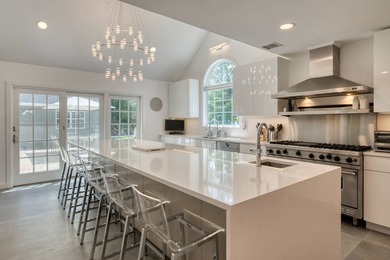 Set on 1.4 exquisitely landscaped acres in coveted East Hampton - photo 5