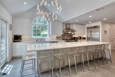 Set on 1.4 exquisitely landscaped acres in coveted East Hampton - photo 7
