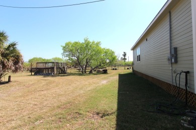 Nestled in the peaceful Copano Cove area, this charming