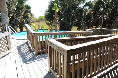 Nestled in the peaceful Copano Cove area, this charming