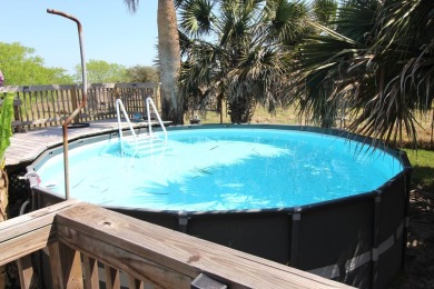 Nestled in the peaceful Copano Cove area, this charming