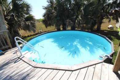 Nestled in the peaceful Copano Cove area, this charming