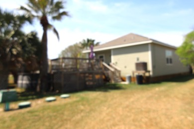 Nestled in the peaceful Copano Cove area, this charming