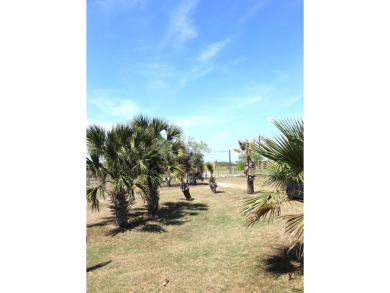 Nestled in the peaceful Copano Cove area, this charming