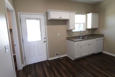 Nestled in the peaceful Copano Cove area, this charming