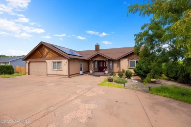 This spacious four-bedroom, four-bath home blends comfort with