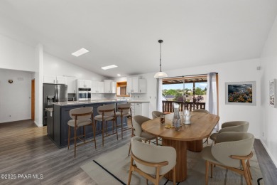 This spacious four-bedroom, four-bath home blends comfort with