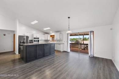 This spacious four-bedroom, four-bath home blends comfort with