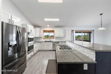 This spacious four-bedroom, four-bath home blends comfort with