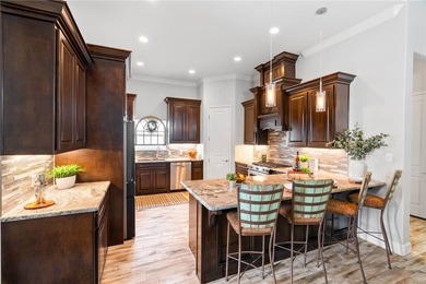 Custom home on a large corner lot with a circular driveway - photo 9