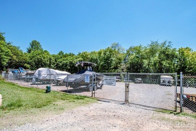 Lake access community featuring a boat ramp, boat dock, boat - photo 40