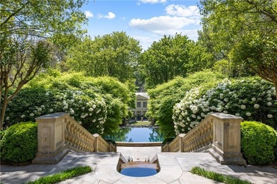 Hidden beyond a gated, winding drive in the heart of - photo 2